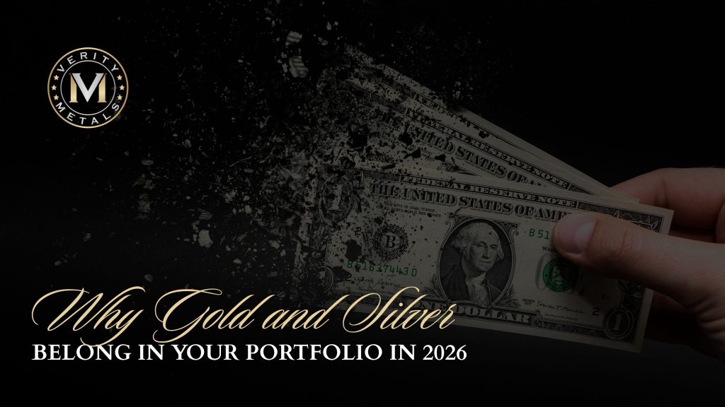 Verity Metals blog graphic showing a hand holding dollar bills that dissolve into fragments, with the headline "Why Gold and Silver Belong in Your Portfolio in 2026."